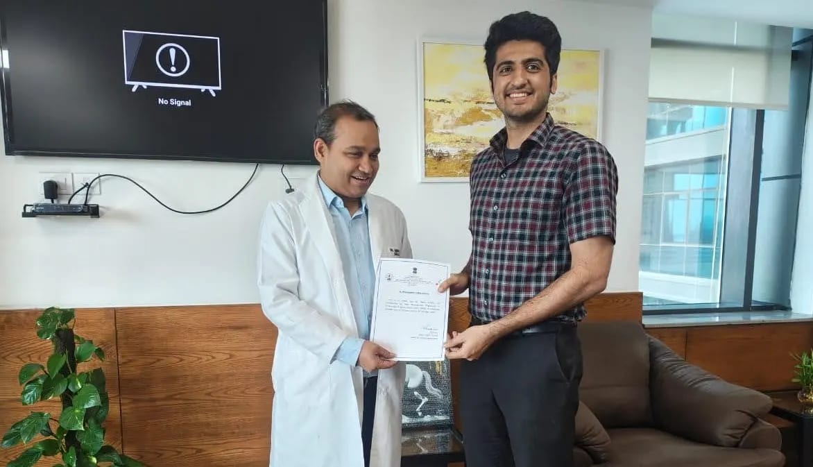 Dr. Dipen Ariwala being presented with an academic recognition letter