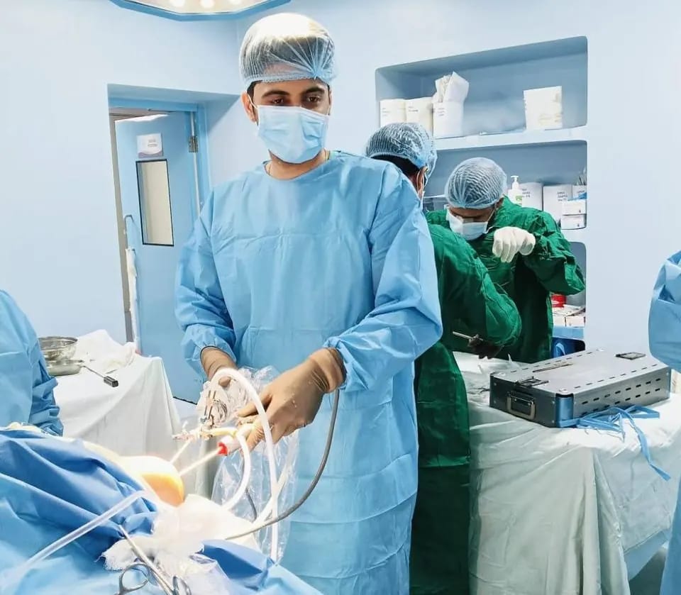 Keyhole knee arthroscopy in progress, instruments entering through two small portals