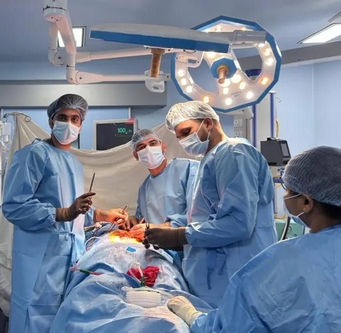 The surgical team working together under theatre lights